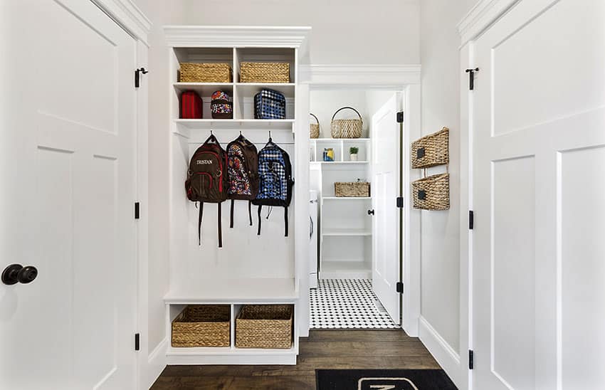Mudroom with cubbies white paint baskets