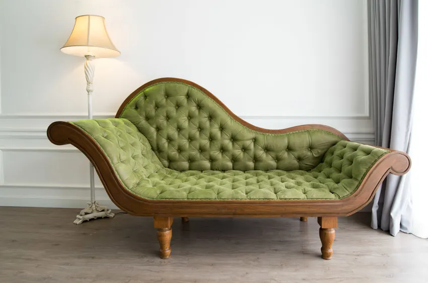 Antique green sofa and floor lamp