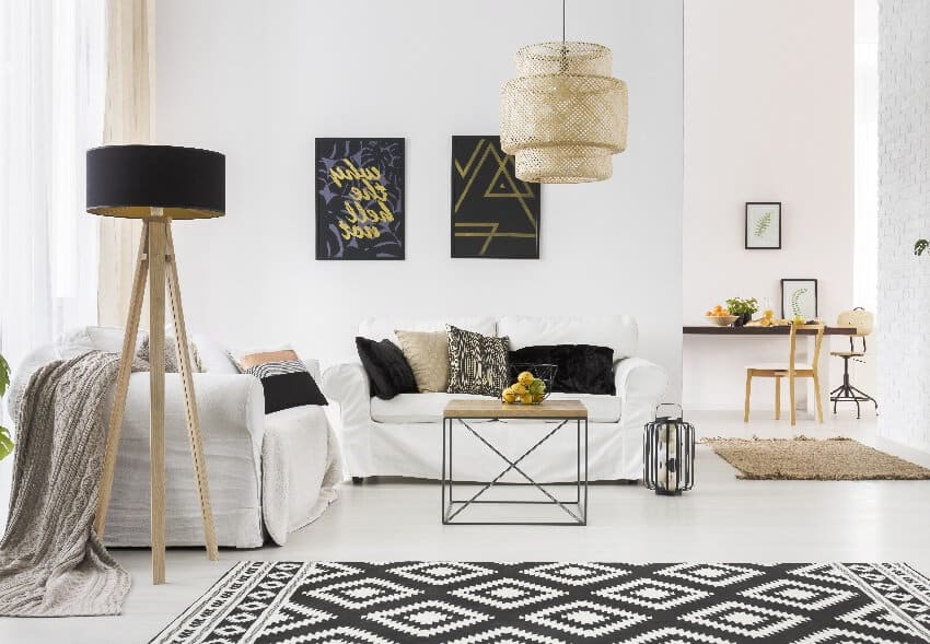 Apartment with white brick wall sofa table and pattern rug
