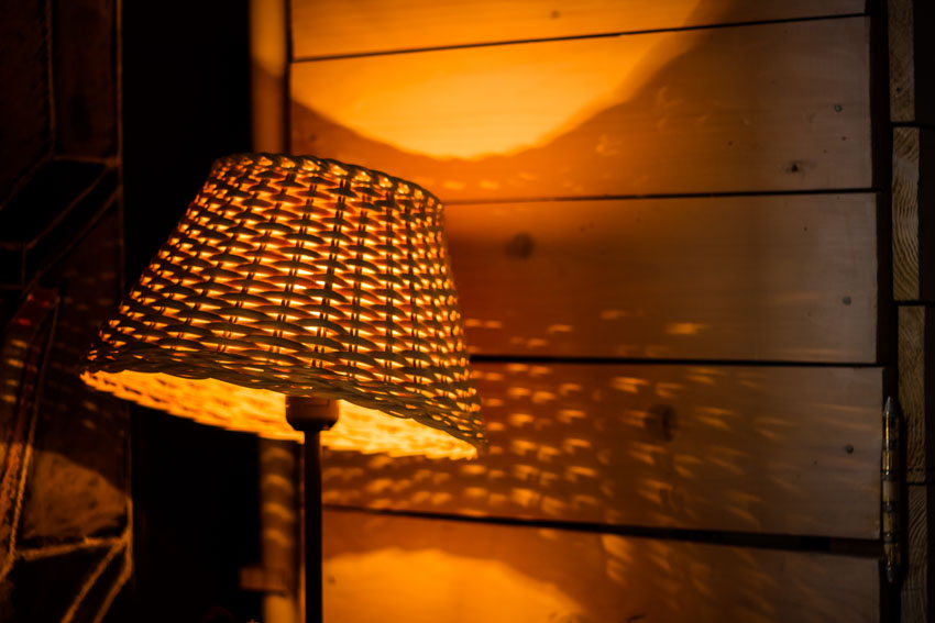 Bamboo lamp shade wood panel wall