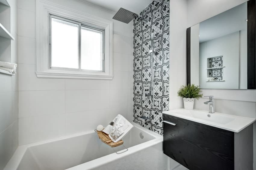 Bathroom with alcove tub mirror sink windows white tiles