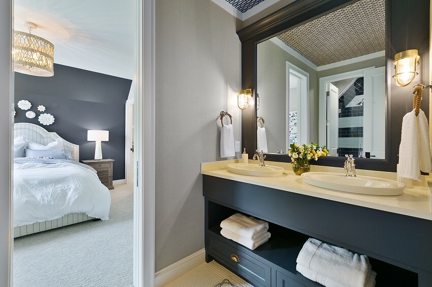 Bathroom with open shelves below sink vanity mirror lighting fixtures and view of the bedroom