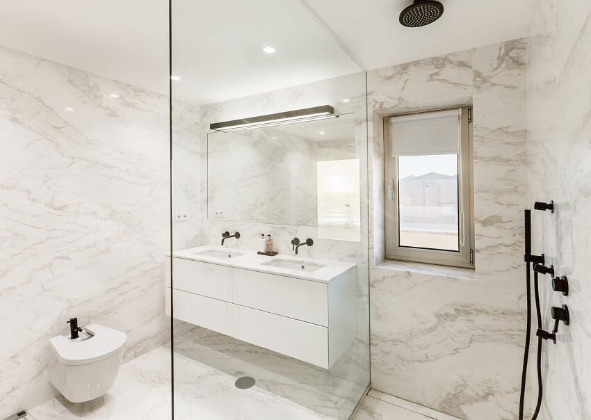 Beautiful bathroom with composite marble walls flooring and sink