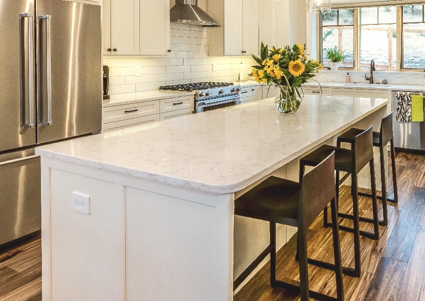 Beautiful kitchen interior with island that has curved countertops