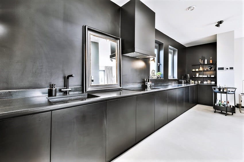 Beautiful kitchen with black cabinets stainless steel countertop open shelves and mirror
