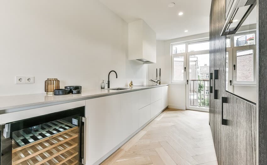 Contemporary galley kitchen with recessed lighting