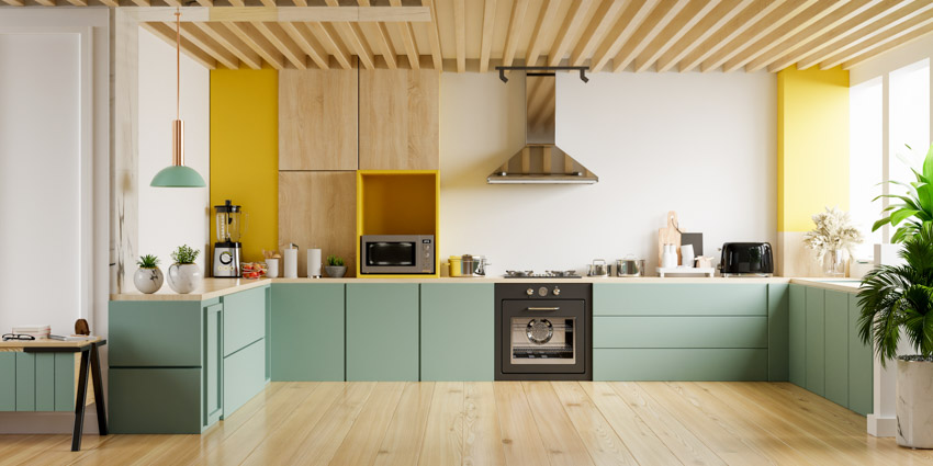 Beautiful kitchen with pastel green and wood cabinets
