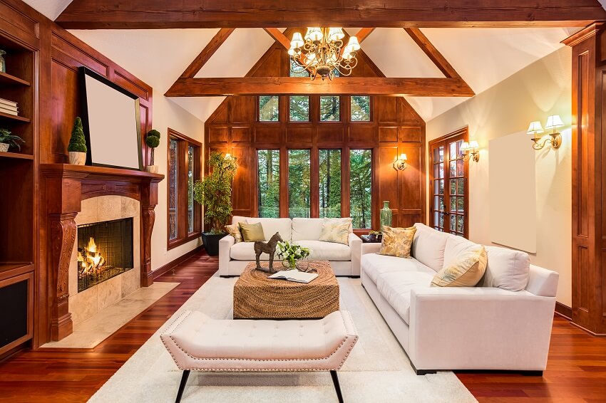 Beautiful living room interior of a ranch house with hardwood floors fireplace built-ins with television and vaulted ceilings