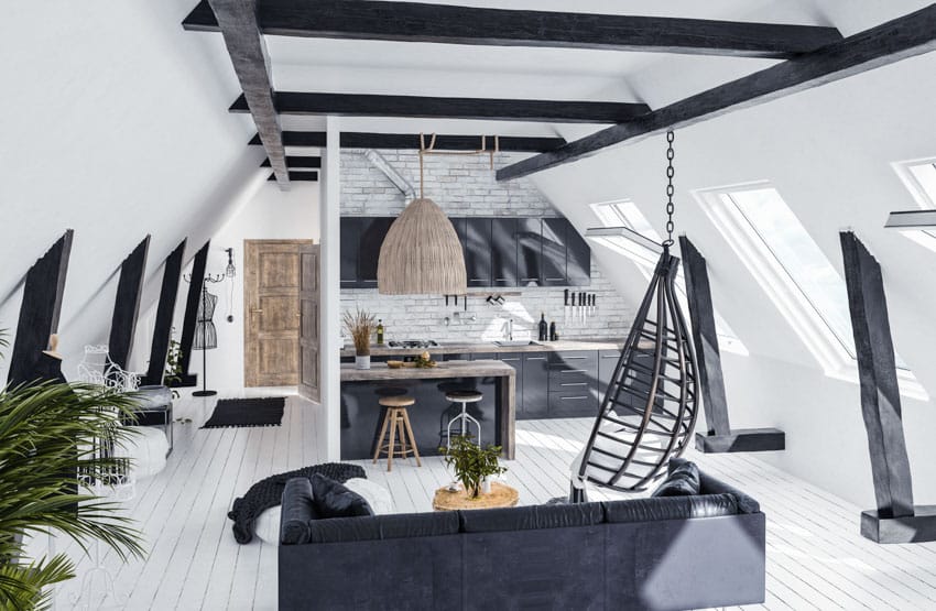 Black and white room hanging chair and black beams criss-cross on ceiling