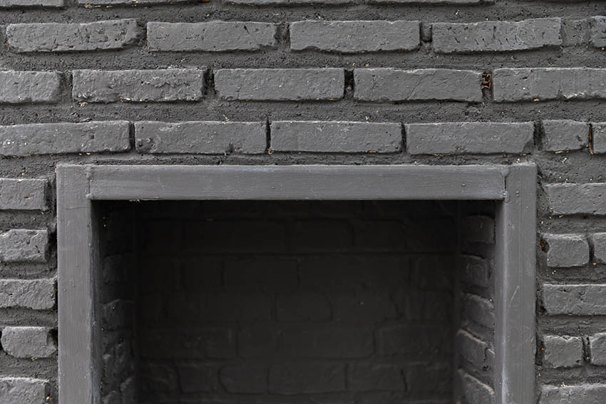 Black painted brick fireplace
