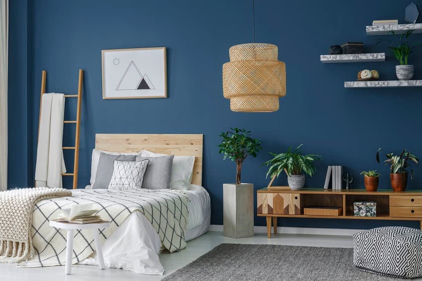 Blue bedroom interior with a modern lamp double bed plants cabinet and more cool things for bedroom