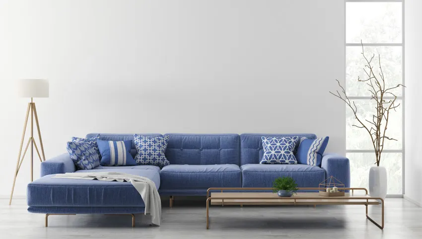 Blue couch with standing lamp