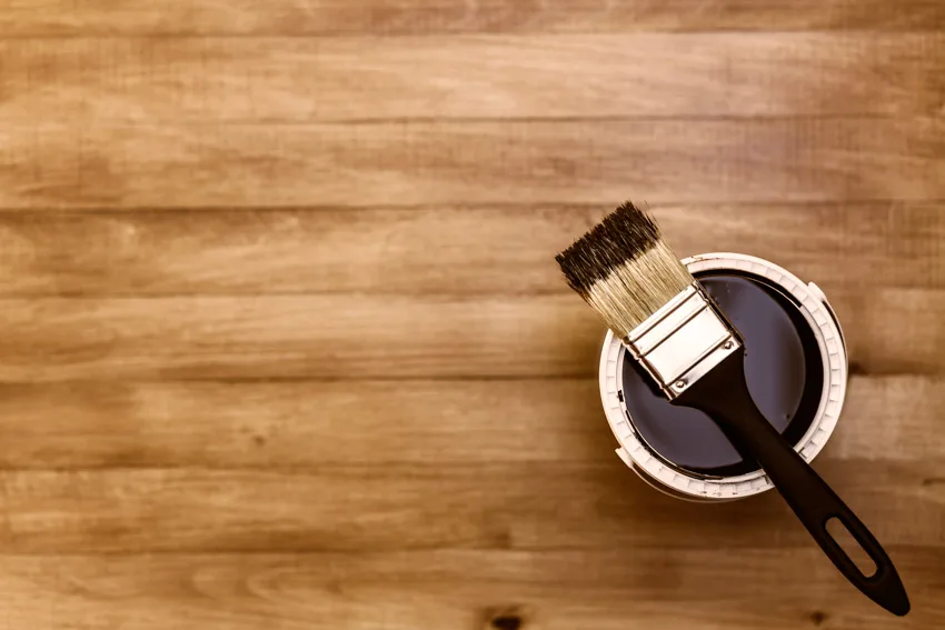 Can of black paint brush wood flooring for vinyl windows