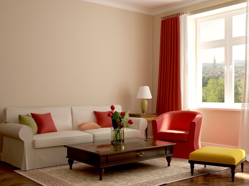 Colorful eclectic style living room with sofa armchair coffee table carpet ottoman and a wonderful view from the window