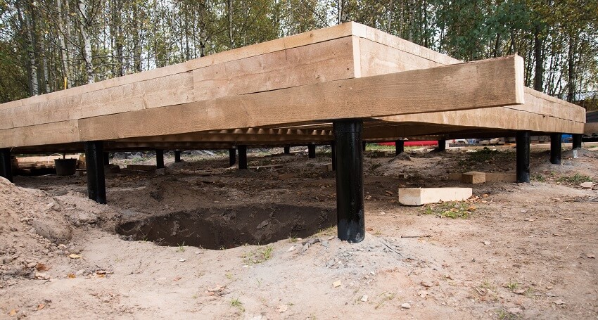 Construction of a raised foundation for a wooden house