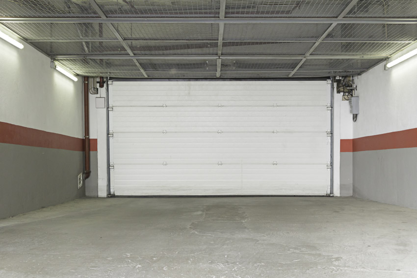 Empty garage with trackless door concrete floor