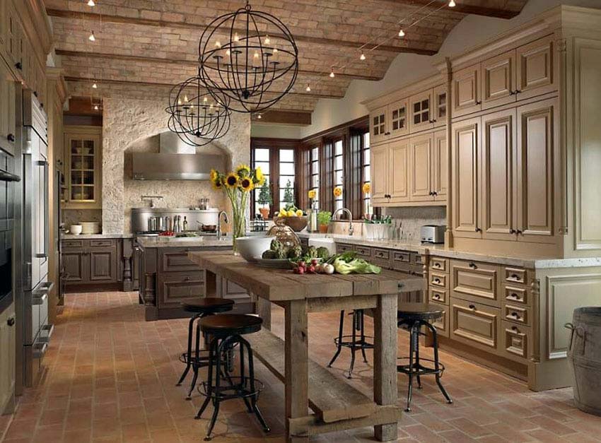 French country timber wood frame kitchen with wood tone cabinets globe pendant lights and rustic wood table