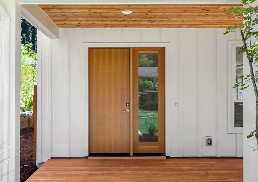 Front door wood deck glass board and batten vinyl siding ceiling