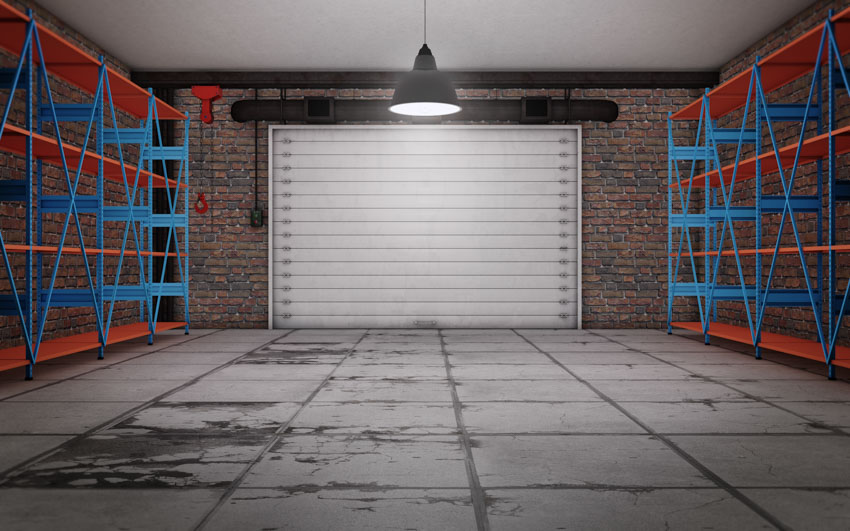 Garage with trackless doors hanging light concrete floor