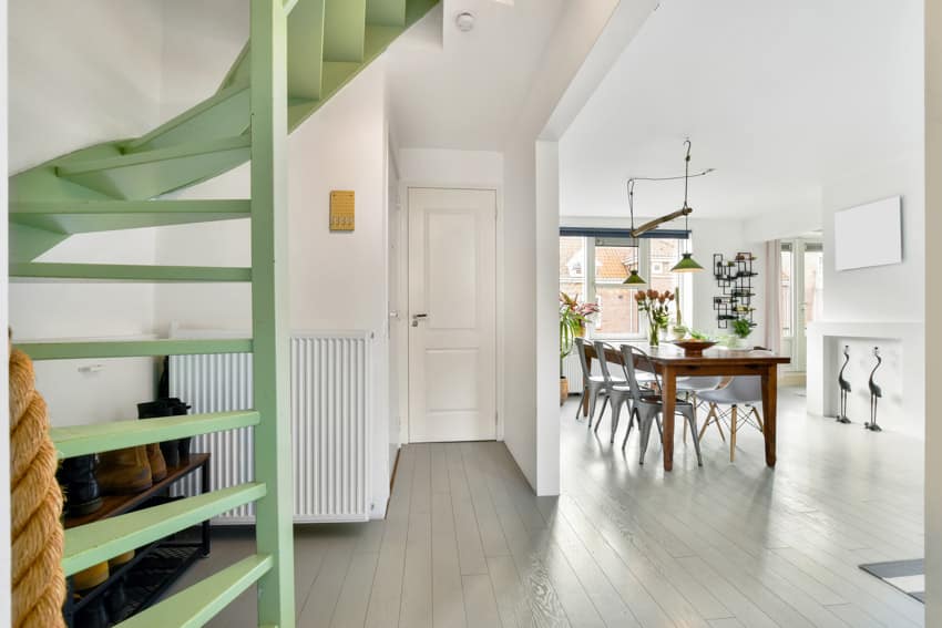 Green stairs house interior dining space white door