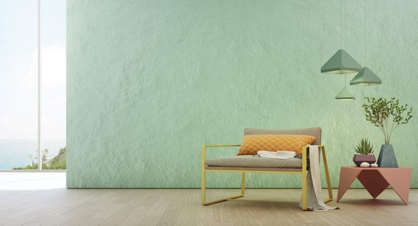 Green textured wall chair wood flooring hanging light