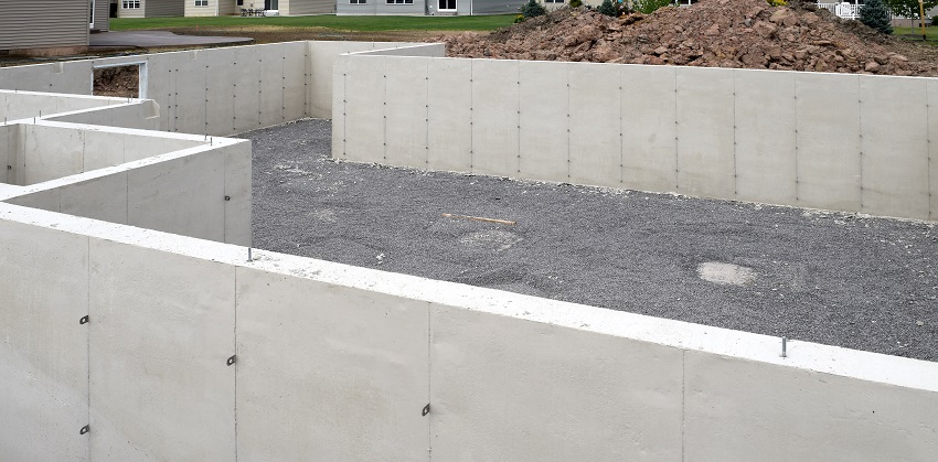 House construction with concrete cement basement foundation