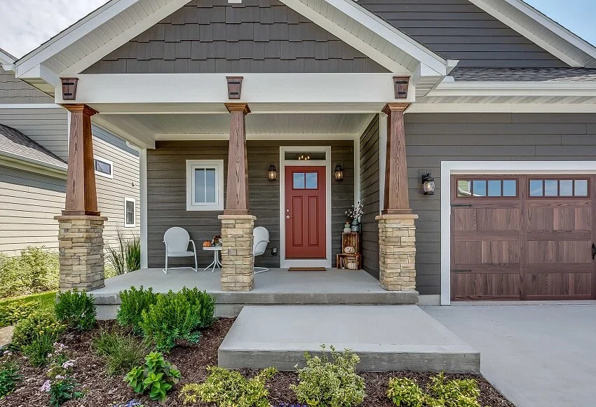 House with concrete platform, steps garage and landscaped front yard