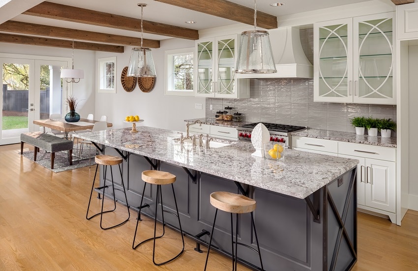 Kitchen in new luxury home with wavy tile backsplash