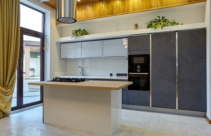 Kitchen with appliances long curtain kitchen island and glass door 