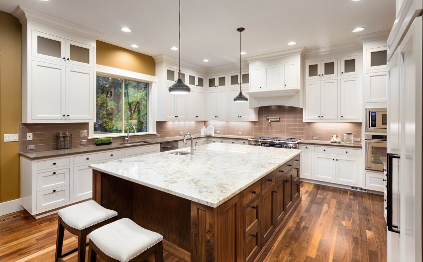 Kitchen with large island with back to back sinks 