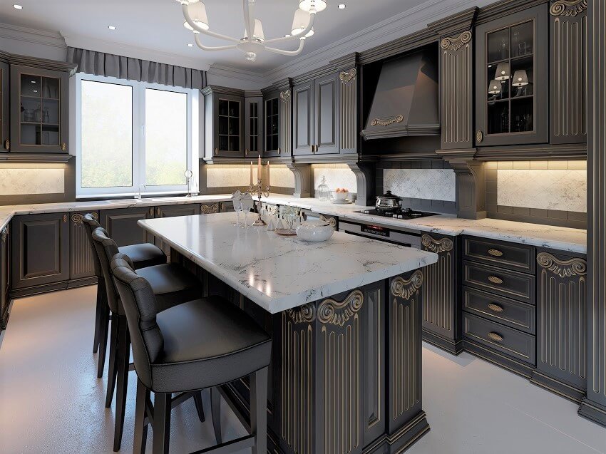 Kitchen with wooden cabinet marble countertop and black bar stools at kitchen island