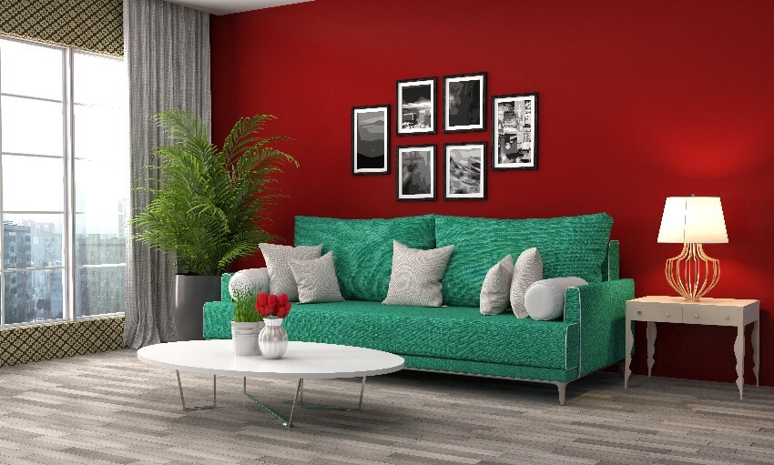 Living room interior with maroon wall grey floors decors floor to ceiling curtains and green sofa with pillows