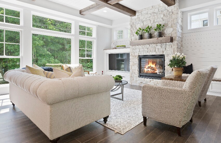 Living room with brick fireplace wood mantel hardwood flooring