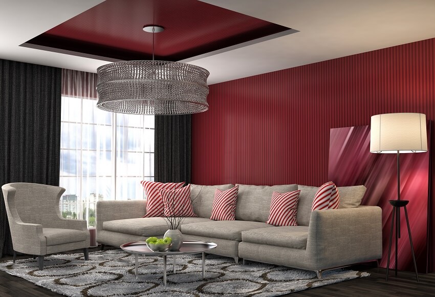 Living area with black curtain combined with maroon textured wall