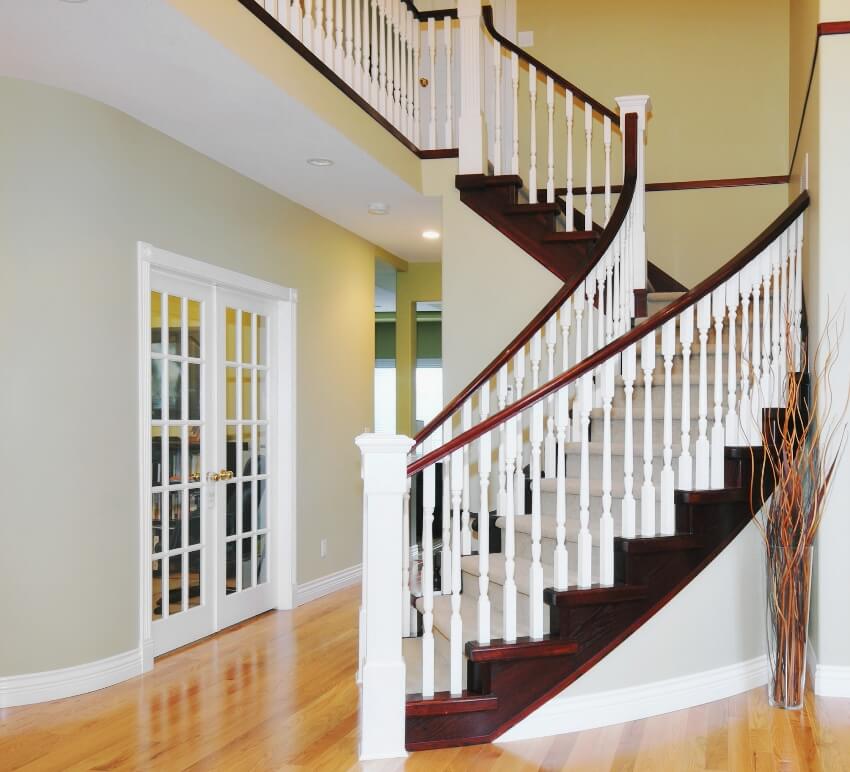 Luxury home with grand staircase and painted banister