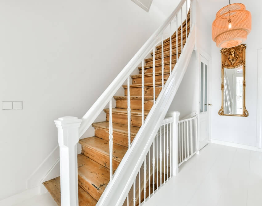 Luxury staircase with white painted banister in an elegant house