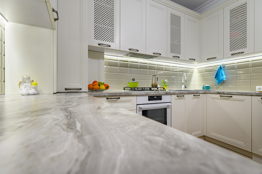 Marble granite countertop kitchen white cabinet backsplash oven