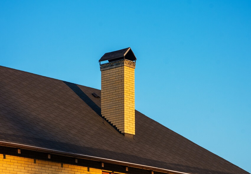 Modern brick chimney with beautiful forging