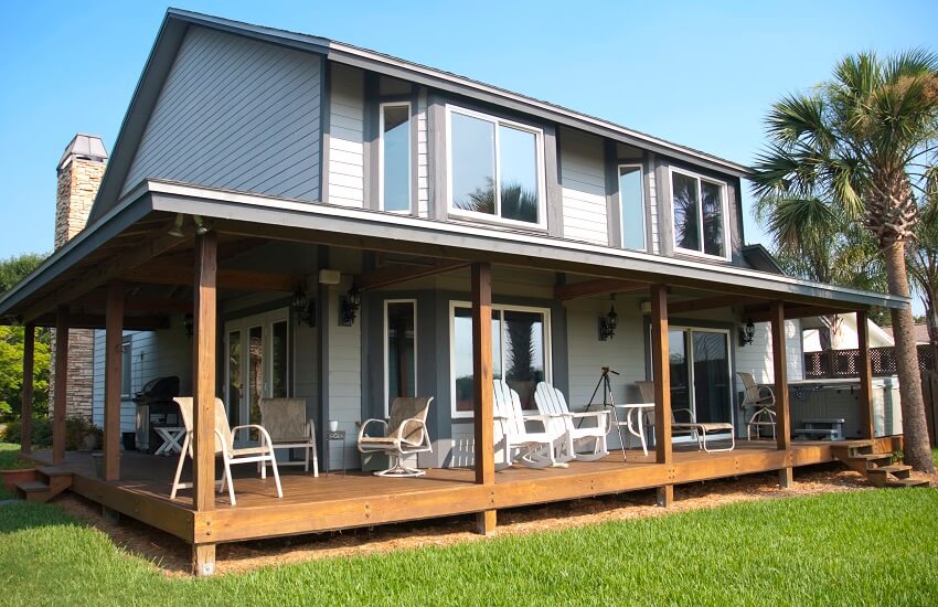 Modern home with wraparound wooden porch