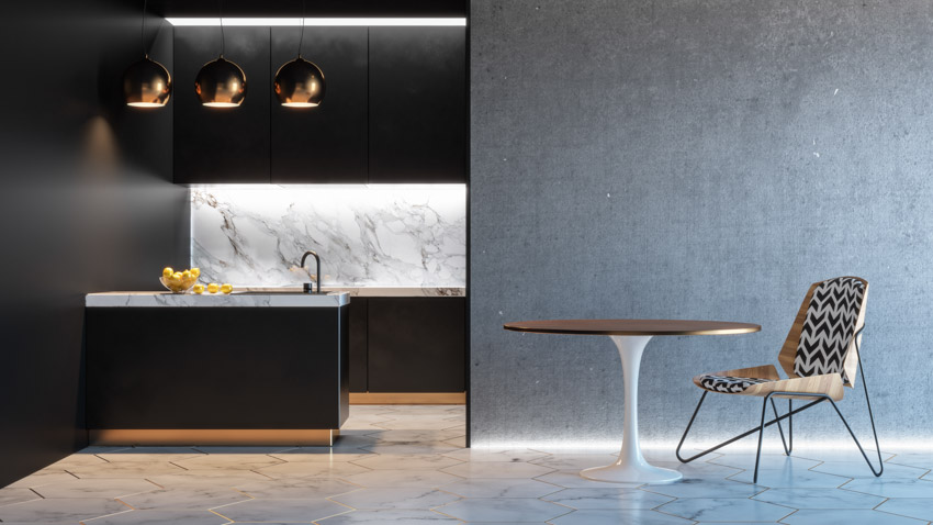 Modern kitchen with black cabinets marble backsplash center island round table chair