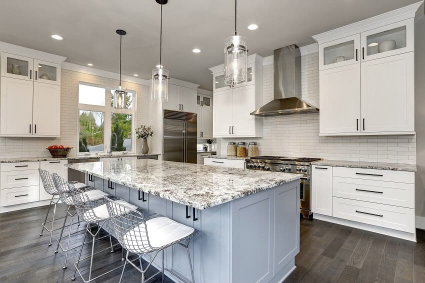 Contemporary kitchen with nice lighting kitchen island, busy granite countertops and subway backsplash