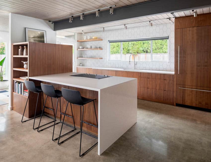 Modern kitchen with zebrawood cabinets, center island, shelves, lighting, wood panel ceiling, and windows