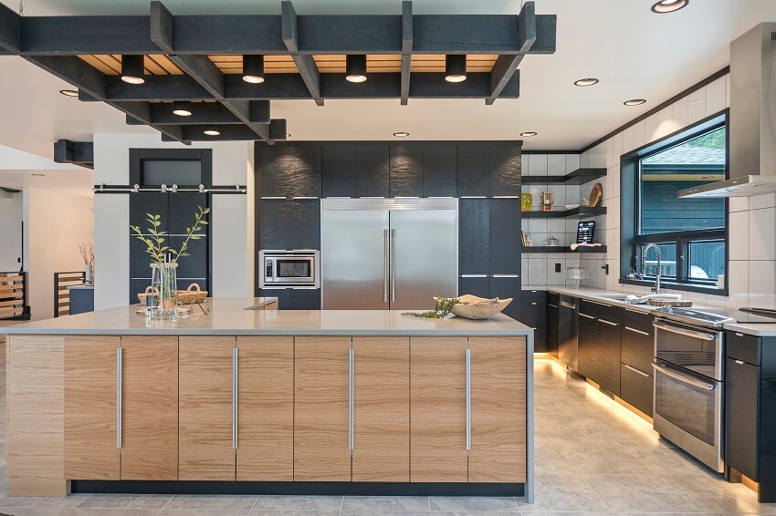 Natural wood and black colors in this beautiful open kitchen