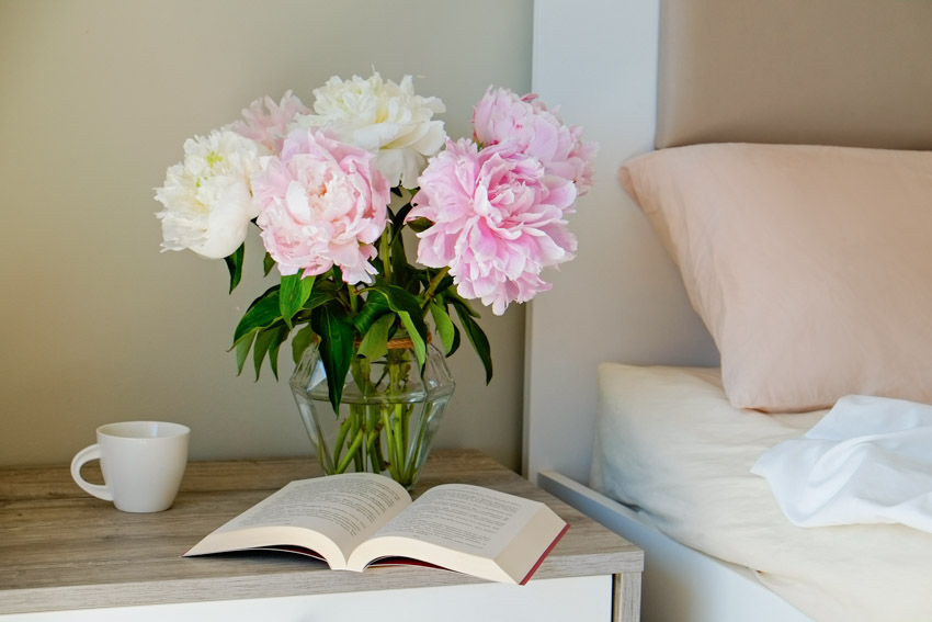 Nightstand with book peony flowers