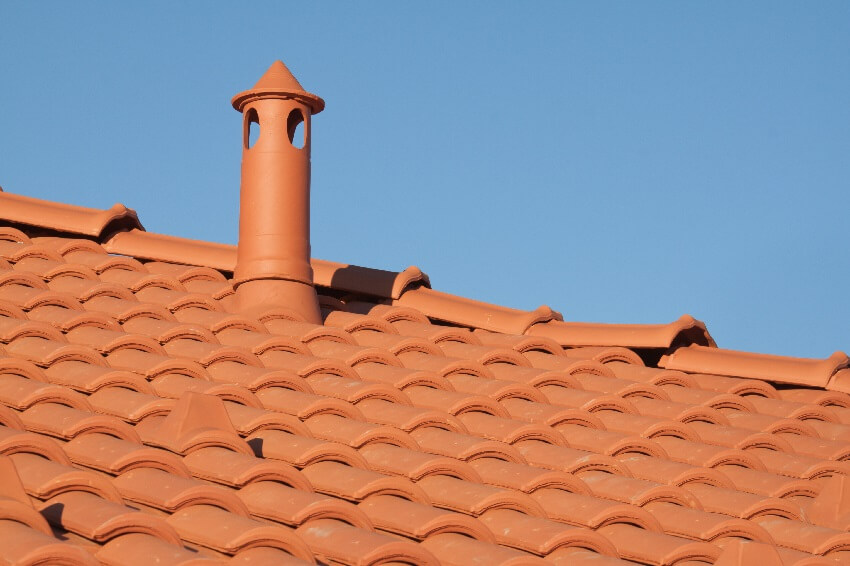 Orange tile roof with chimney