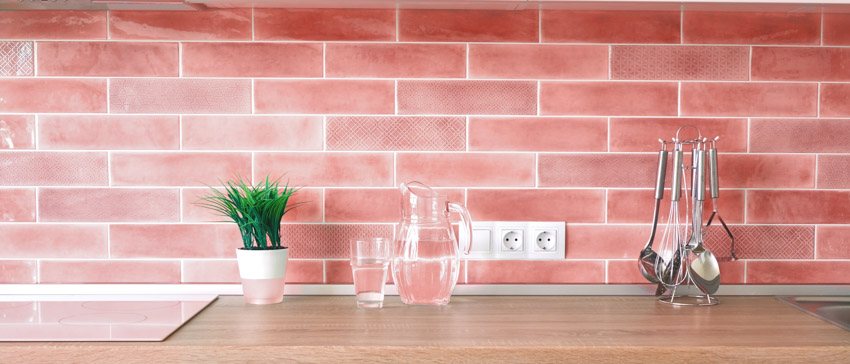 Pink tiles kitchen backsplash wood countertop