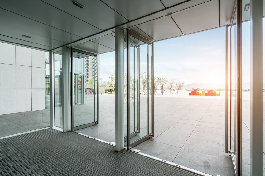 Pivot glass doors leading to outdoor area