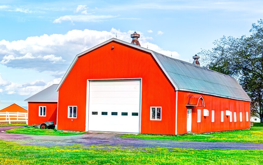 Red orange painted barn shed with gambrel design
