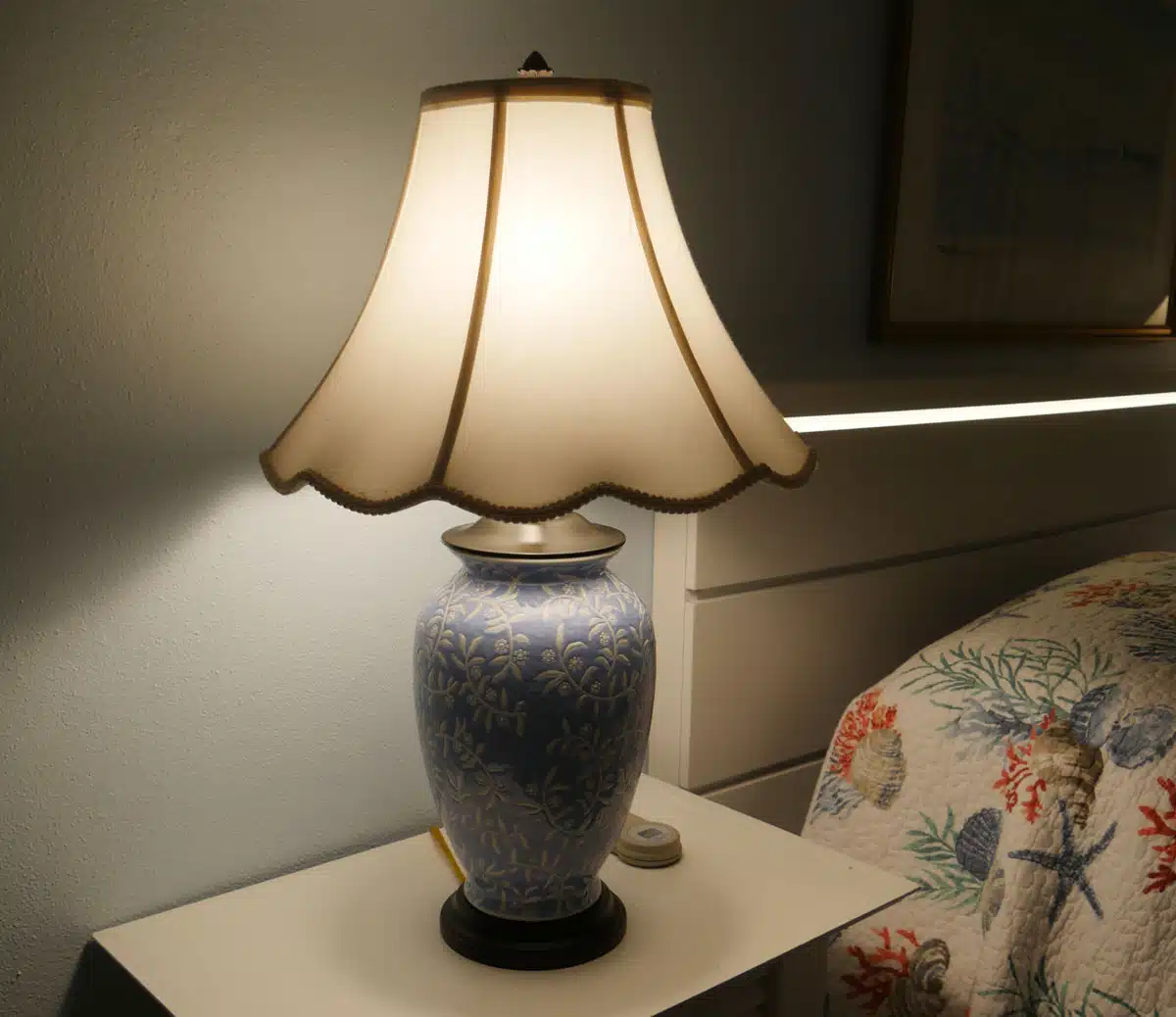 scalloped edge lamp on nightstand