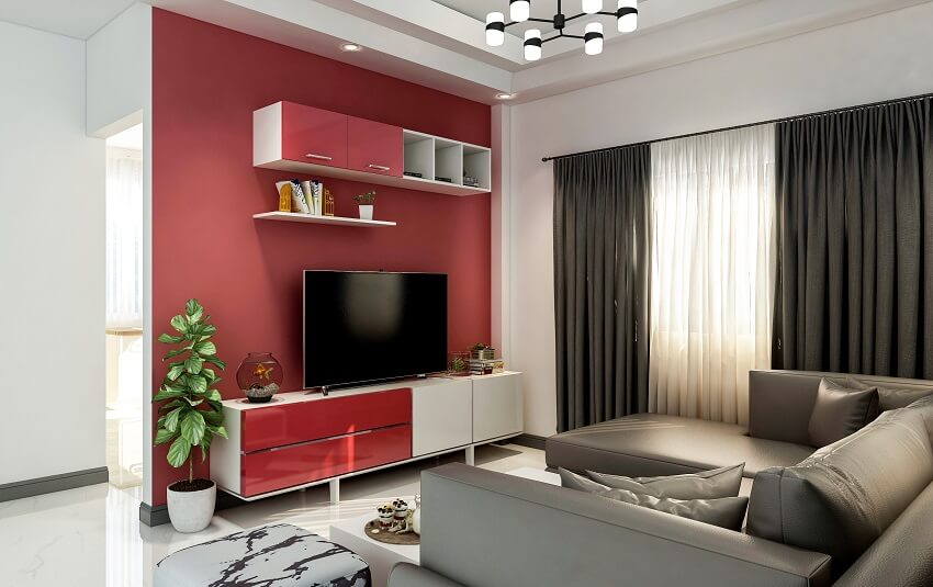 Small living room with maroon & white walls cabinets open shelves sofa chandelier and dark grey curtain